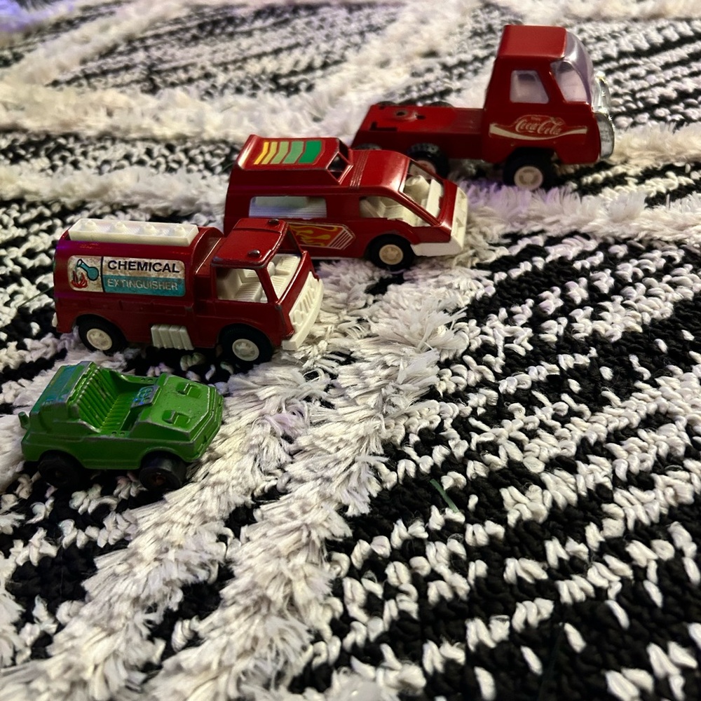 Lot of four vintage metal assorted toy vehicles
